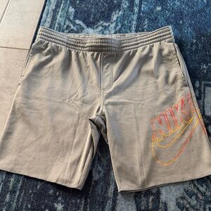 Nike Men’s Gray Athletic Shorts with Orange and Yellow Logo